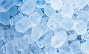 Various ice cubes scattered across a surface, showcasing different shapes and sizes, like an artistic display of an ice delivery in progress.